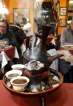 Staff preparing to serve coffee to guests
